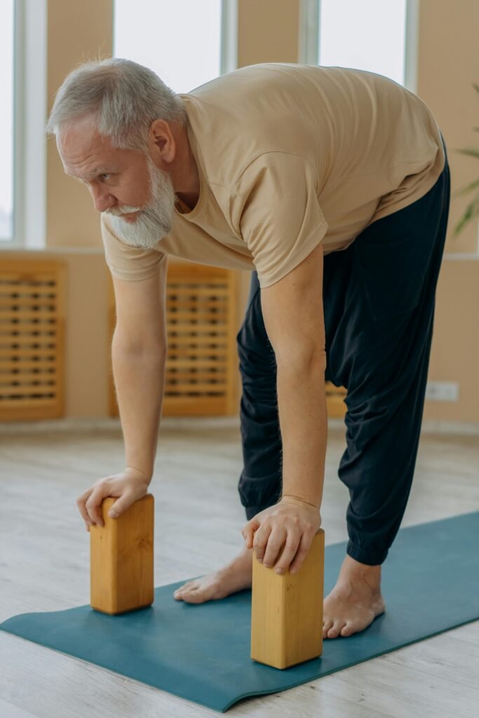 Senior man exercising at home, part of FitLifeBoost workouts and wellness