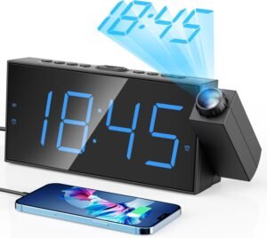 Digital bedside alarm clock on nightstand for consistent wake-up time