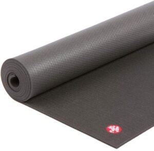 Manduka PRO yoga mat rolled for evening mobility work

