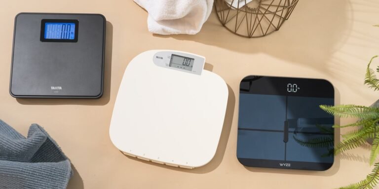 Bare feet standing on a modern digital body weight scale