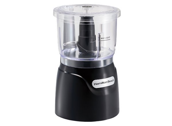Hamilton Beach electric vegetable processor with fresh chopped vegetables on counter