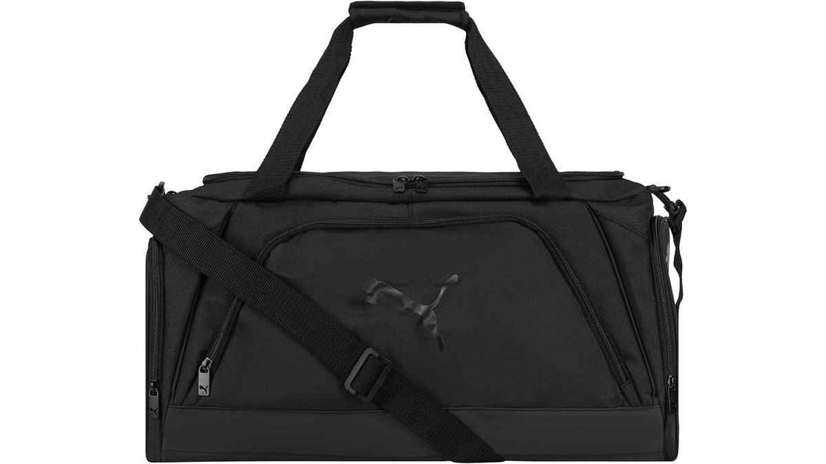 PUMA Accelerator Duffel Bag displayed in a bright modern gym environment.